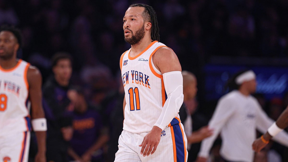 New York Knicks guard Jalen Brunson (11) walks across the court during a time out during the first half against the Phoenix Suns at Madison Square Garden.