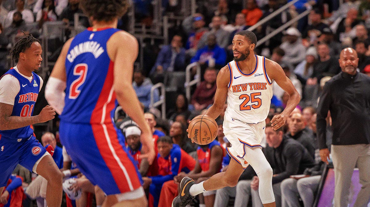 New York Knicks forward Mikal Bridges (25) moves the ball up court against the Detroit Pistons during the first half at Little Caesars Arena