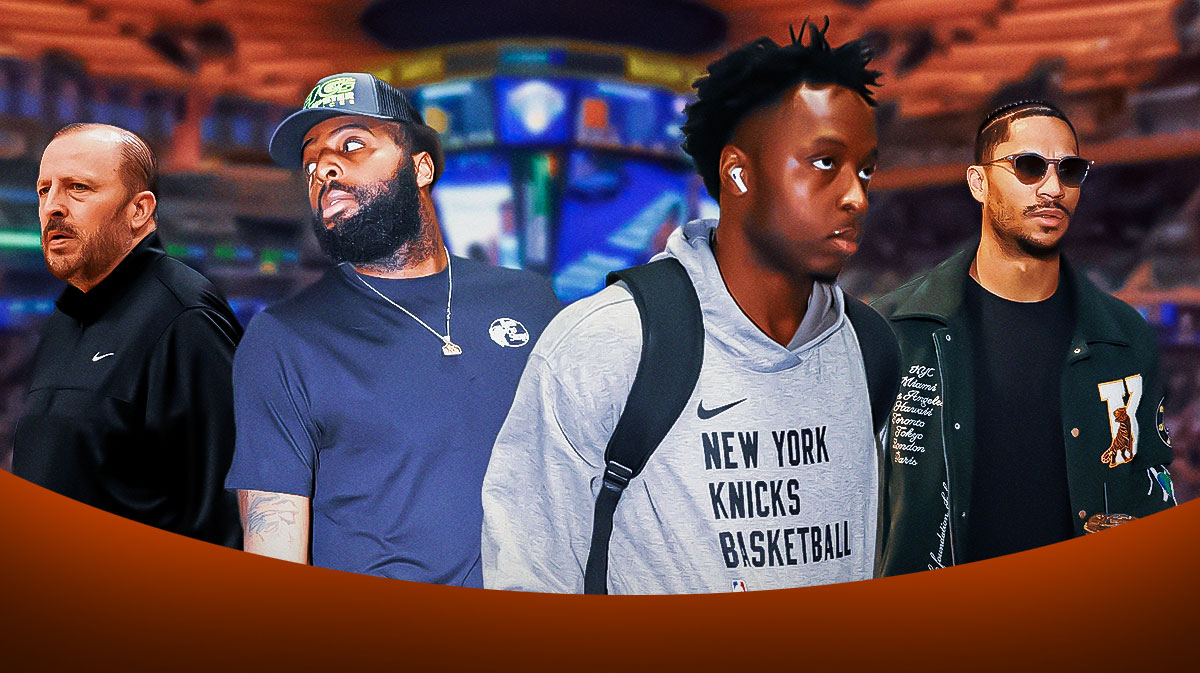 Thibodeau grinning and Mitchell Robinson, Josh Hart, and OG Anunoby in street clothes (and in Anunoby's case, maybe his winter jacket with the hood up).