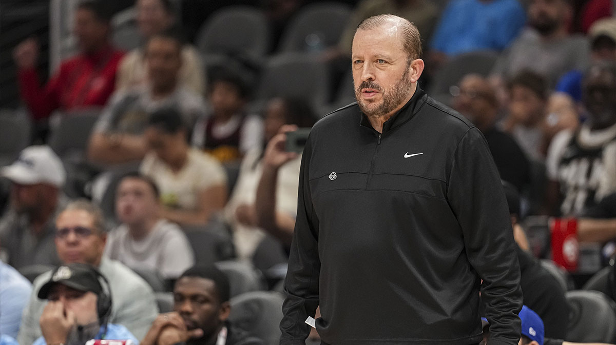 Knicks head coach Tom Thibodeau next to ESPN's Kendrick Perkins