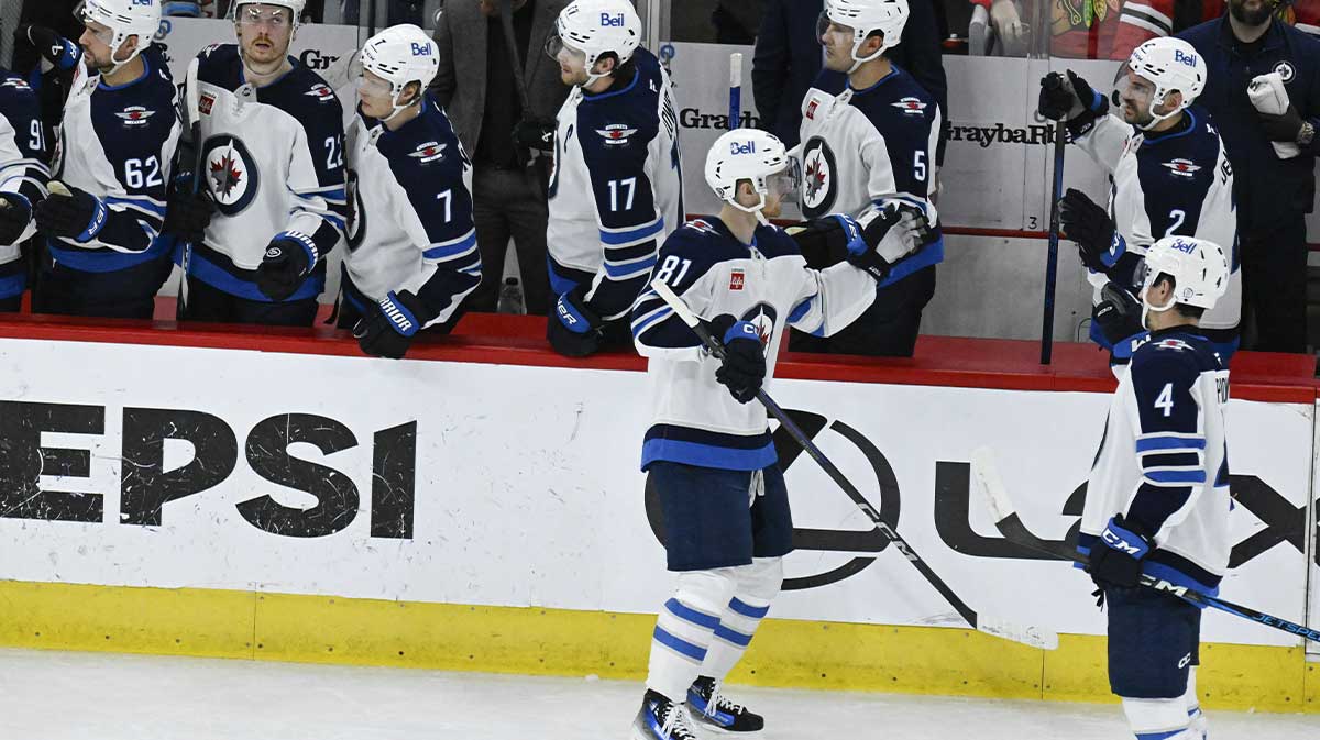 Winnipeg Jets left wing Kyle Connor (81) celebrates with teammates after scoring s goal against the Chicago Blackhawks during the second period at United Center.