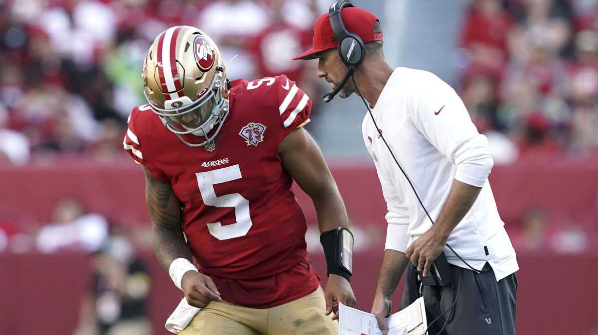 San Francisco 49ers head coach Kyle Shanahan talks to quarterback Trey Lance (5) during the fourth quarter against the Seattle Seahawks at Levi's Stadium.