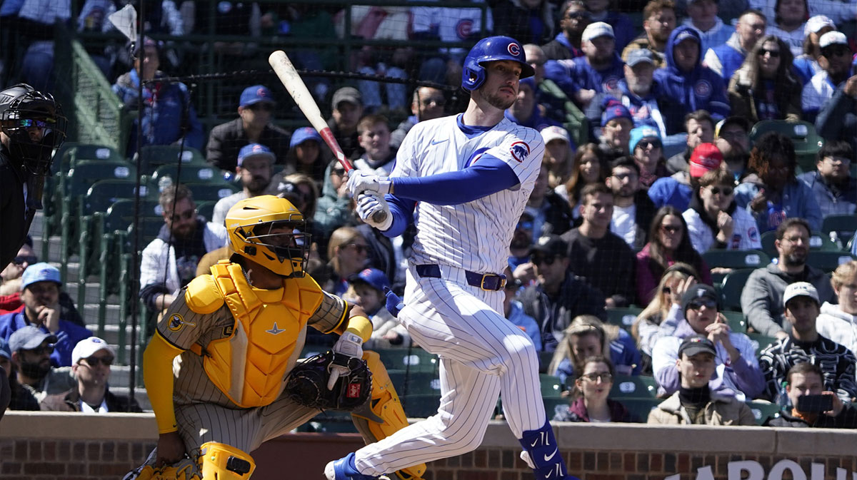 Chicago Cubs outfielder Kyle Tucker (30) hits a one run single against the San Diego Padres during the first inning at Wrigley Field.