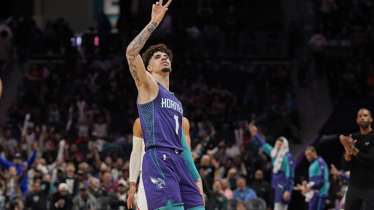 Charlotte Hornets guard LaMelo Ball (1) signals for his three point shot against the New York Knicks during the second half at Spectrum Center.