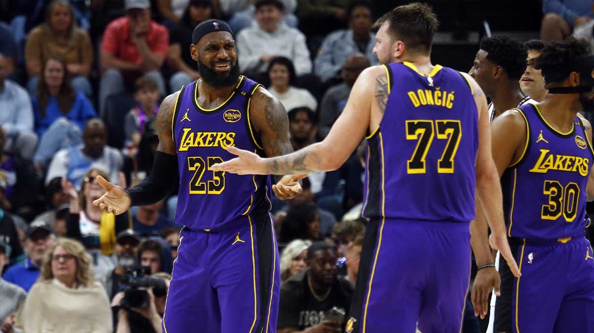 Los Angeles Lakers forward LeBron James (23) and guard Luka Doncic (77) react during the third quarter against the Memphis Grizzlies at FedExForum.