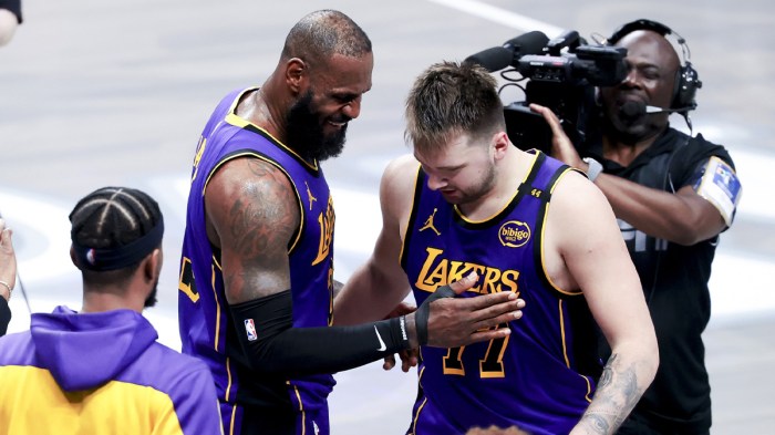 Lakers forward LeBron James (23) celebrates with Los Angeles Lakers guard Luka Doncic (77)