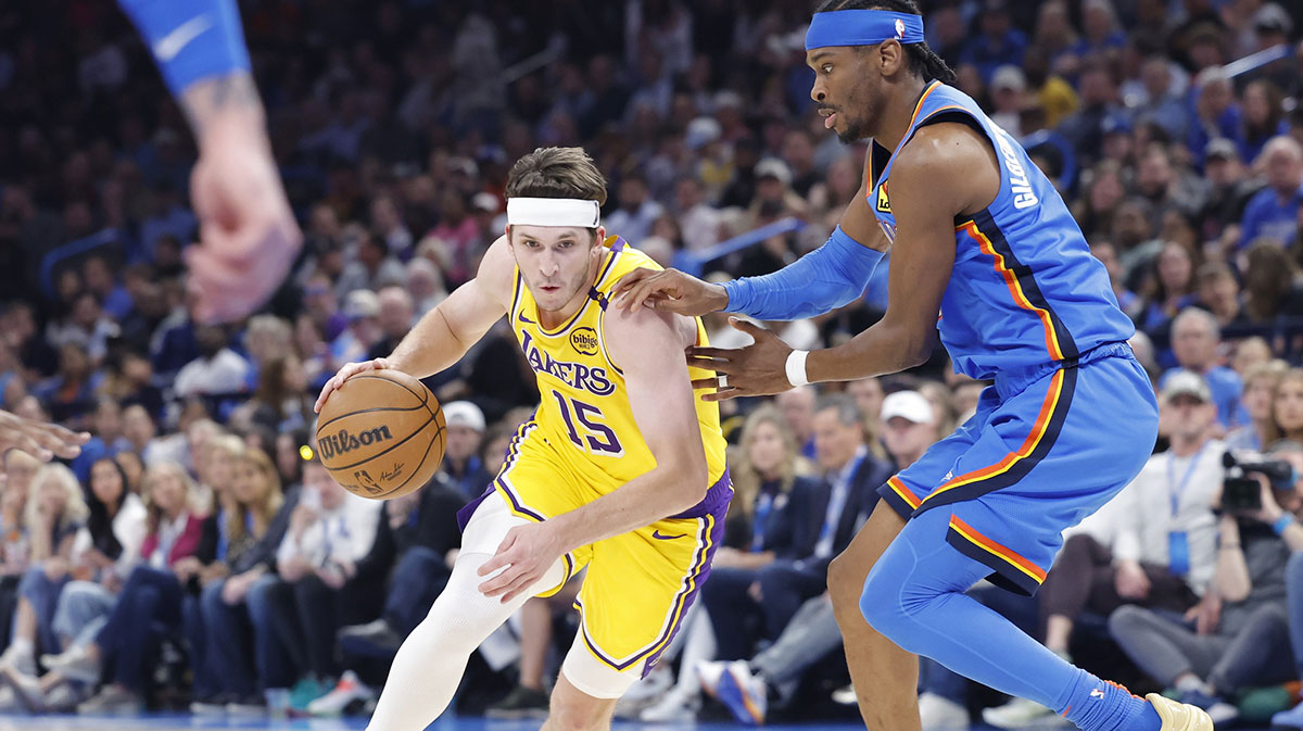 Lakers guard Austin Reaves (15) drives against Oklahoma City Thunder guard Shai Gilgeous-Alexander (2) during the second quarter at Paycom Center