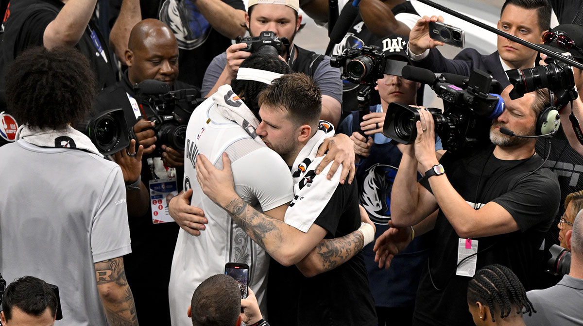 Lakers guard Luka Doncic (77) and Dallas Mavericks forward Anthony Davis (3) after the game between the Dallas Mavericks and the Los Angeles Lakers at American Airlines Center