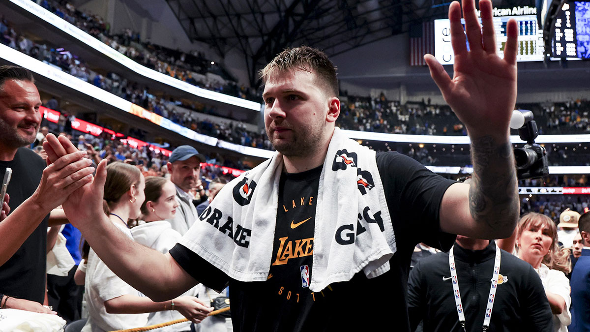 Los Angeles Lakers guard Luka Doncic (77) waves to fans after the game against the Dallas Mavericks at American Airlines Center.