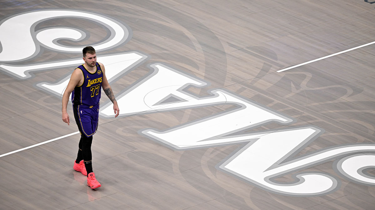 Los Angeles Lakers guard Luka Doncic (77) walks back on to the court during the fourth quarter against the Dallas Mavericks at the American Airlines Center.