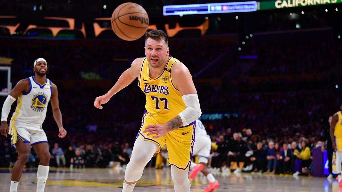 Los Angeles Lakers guard Luka Doncic (77) plays for the ball against the Golden State Warriors during the second half at Crypto.com Arena.