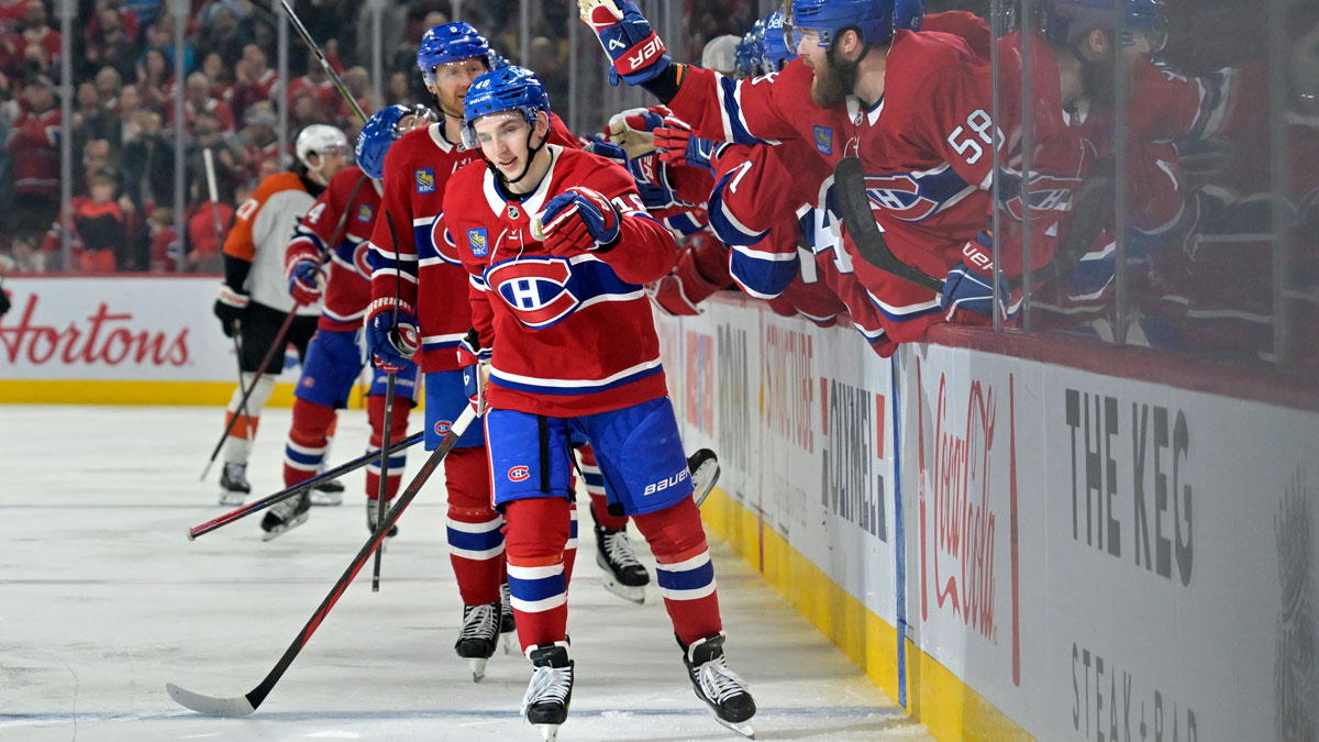 Montreal Canadiens defenseman Lane Hutson (48) celebrates with teammates after scoring a goal against the Philadelphia Flyers during the third period at the Bell Centre.