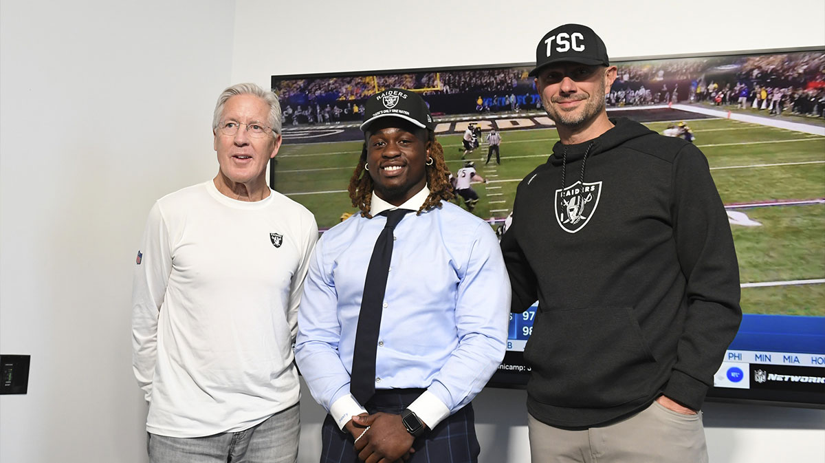 Las Vegas Raiders head coach Pete Carroll, Ashton Jeanty and general manager John Spytek pose after a news conference introducing Jeanty as the first round draft pick in the 2025 NFL Draft at Intermountain Health Performance Center.