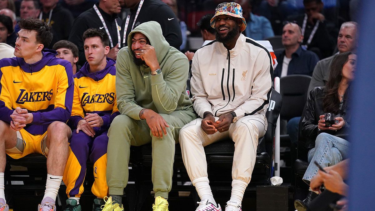 Los Angeles Lakers center Anthony Davis (3) and forward LeBron James (23) watch action against the Golden State Warriors in the second quarter at the Chase Center