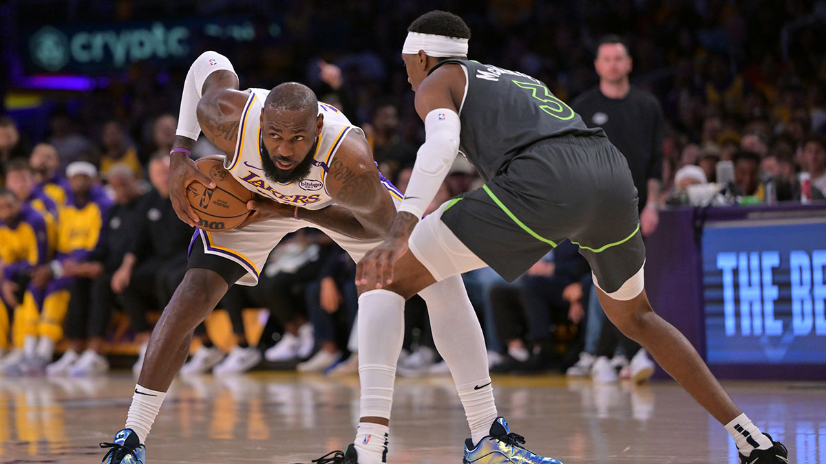 Los Angeles Lakers forward LeBron James (23) is defended by Minnesota Timberwolves forward Jaden McDaniels (3) in the first quarter at Crypto.com Arena. Mandatory Credit: Jayne Kamin-Oncea-Imagn Images