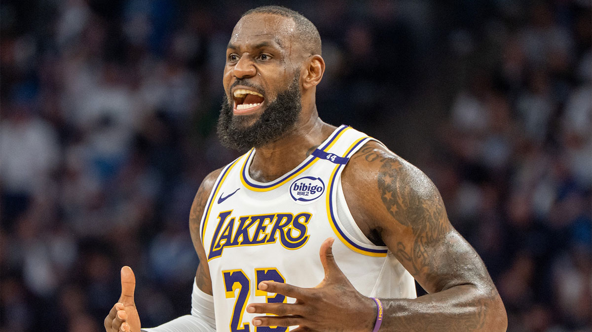 Los Angeles Lakers forward LeBron James (23) talks with his coach during a stoppage in play against the Minnesota Timberwolves in the second quarter during game four of first round for the 2025 NBA Playoffs at Target Center.