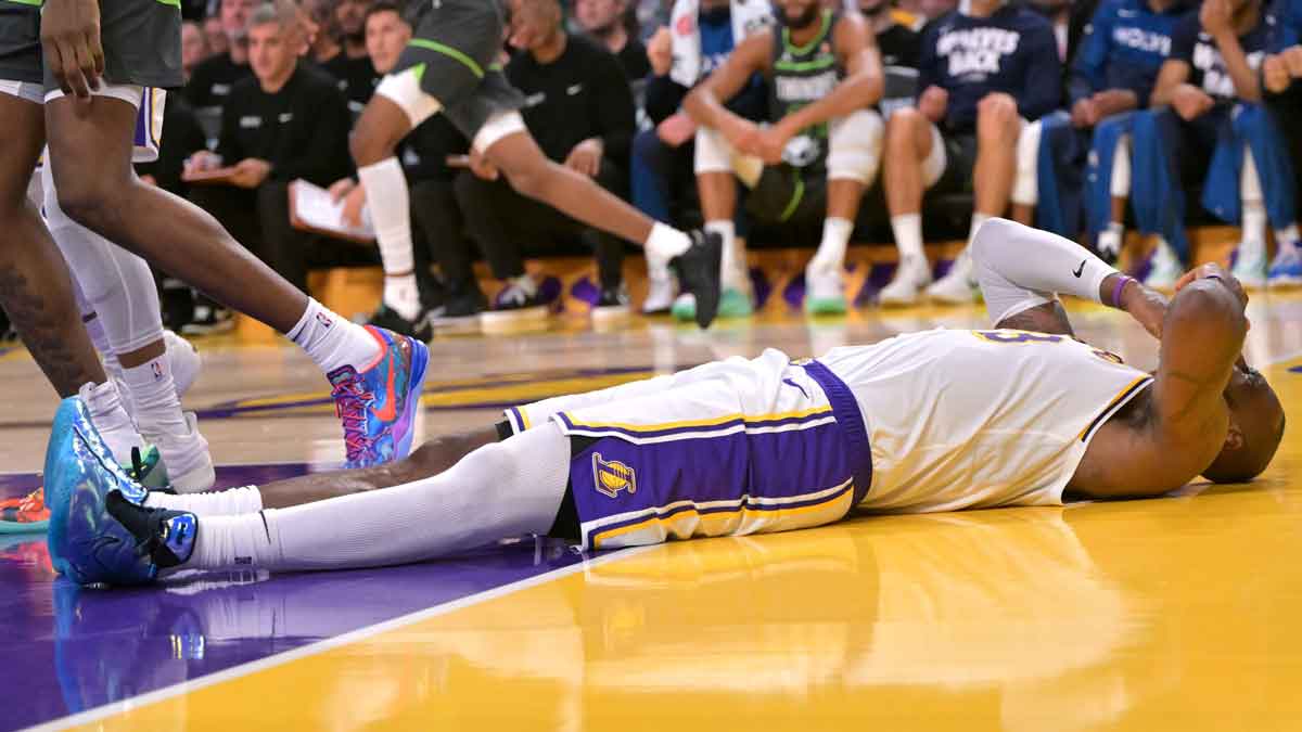 Los Angeles Lakers forward LeBron James (23) reacts after taking an elbow from Minnesota Timberwolves forward Julius Randle (30) in the second half at Crypto.com Arena.
