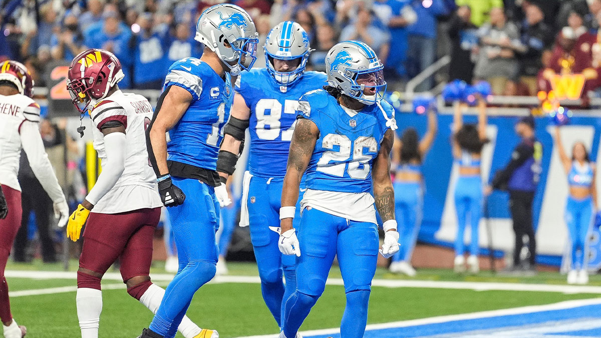 Detroit Lions running back Jahmyr Gibbs (26) celebrates a touchdown against Washington Commanders during the second half of the NFC divisional round at Ford Field in Detroit on Saturday, Jan. 18, 2025.