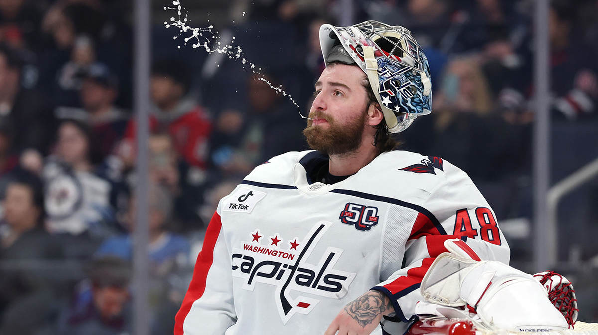 Washington Capitals goaltender Logan Thompson (48) makes a water stream before the start of the second period against the Winnipeg Jets at Canada Life Centre
