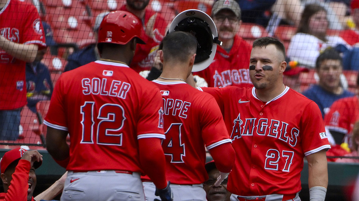 Apr 2, 2025; St. Louis, Missouri, USA; Los Angeles Angels catcher Logan O'Hoppe (14) receives the fire helmet from right fielder Mike Trout (27) after hitting a grand slam against the St. Louis Cardinals during the seventh inning at Busch Stadium. Mandatory Credit: Jeff Curry-Imagn Images