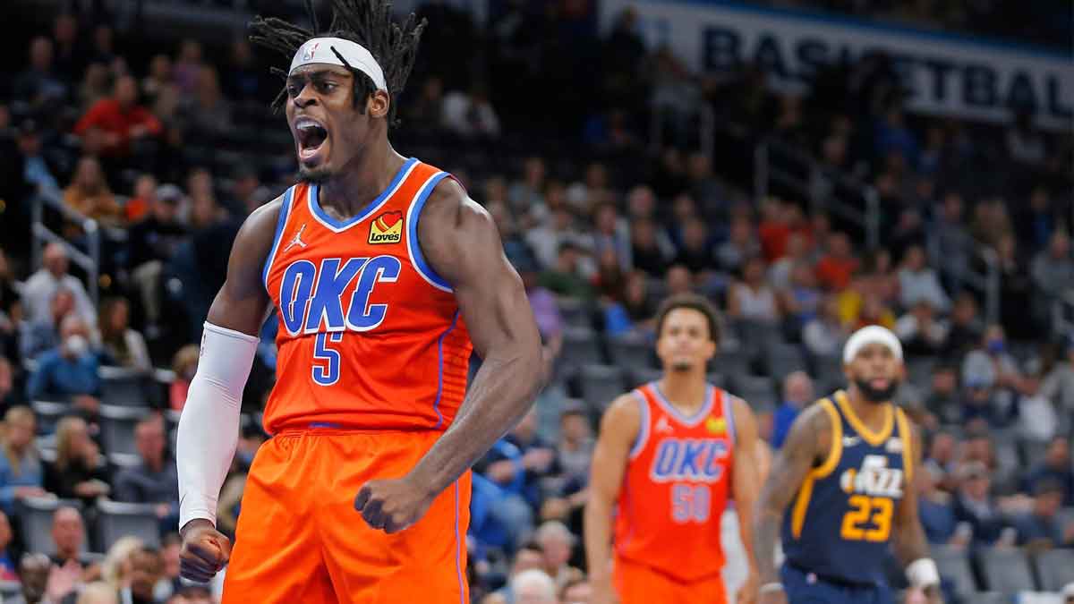 OKC's Lu Dort (5) celebrates after a basket against Utah on Nov. 24 at Paycom Center. cover