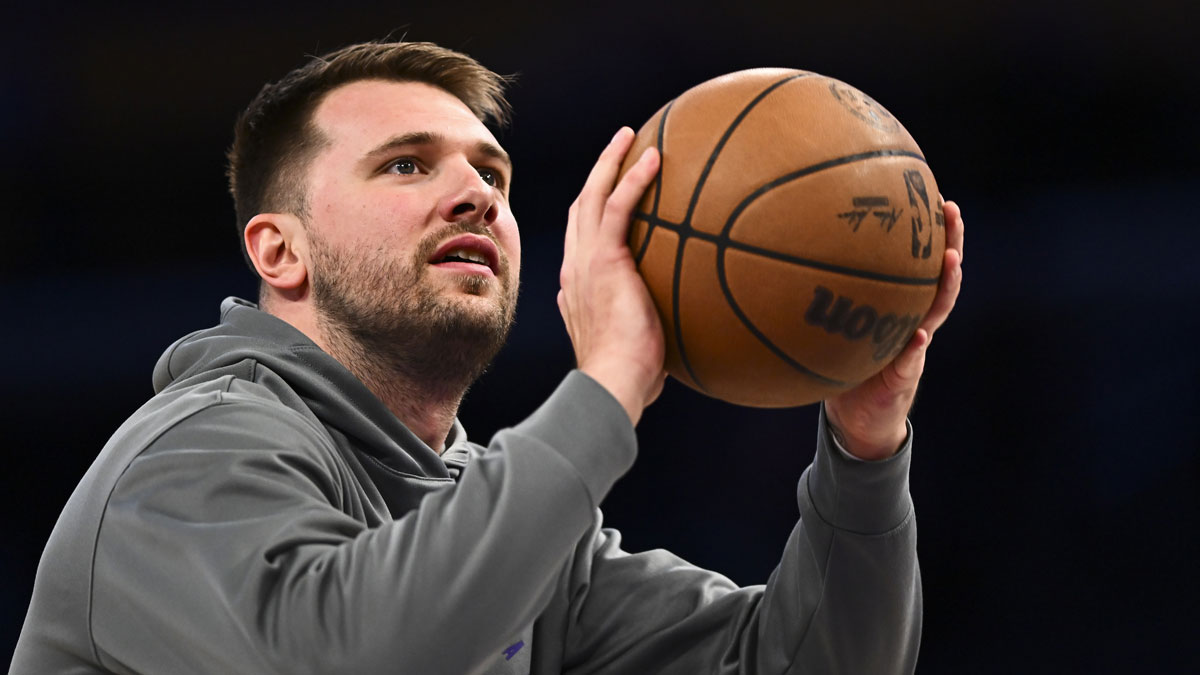 Los Angeles Lakers guard Luka Doncic (77) shoots before the game against the Houston Rockets at Crypto.com Arena.