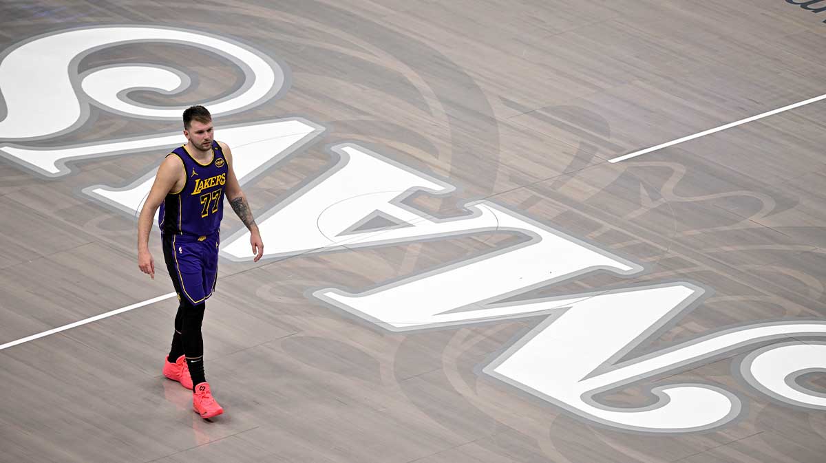 Los Angeles Lakers guard Luka Doncic (77) walks back on to the court during the fourth quarter against the Dallas Mavericks at the American Airlines Center.