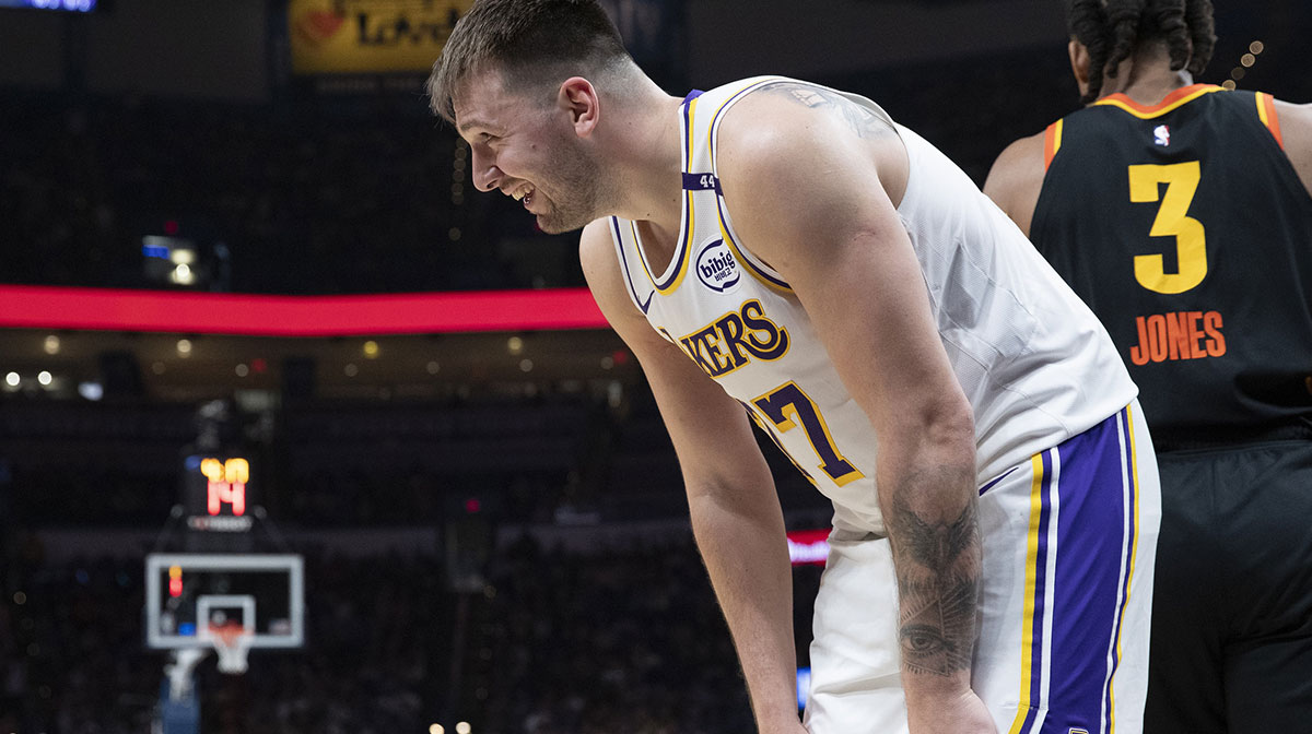 Los Angeles Lakers guard Luka Doncic (77) laughs after a play against the Oklahoma City Thunder during the second half at Paycom Center.