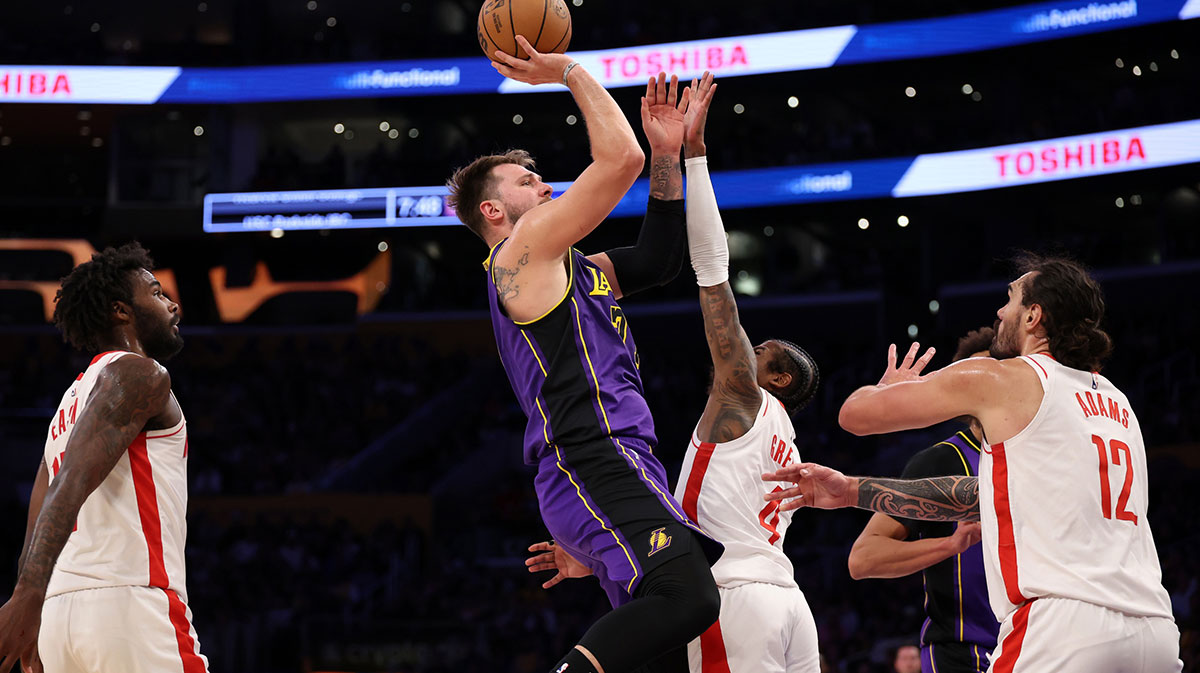Los Angeles Lakers guard Luka Doncic (77) shoots the ball over Houston Rockets guard Jalen Green (4) during the first half at Crypto.com Arena.