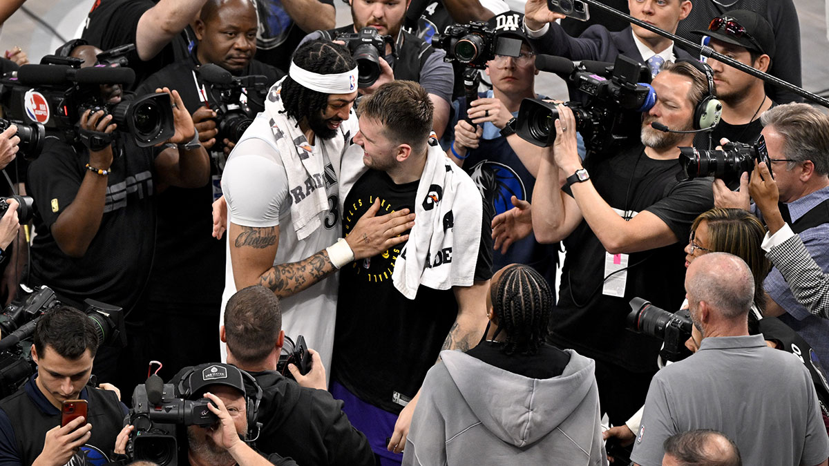 Dallas Mavericks forward Anthony Davis (3) talks with Los Angeles Lakers guard Luka Doncic (77) after the game at the American Airlines Center.