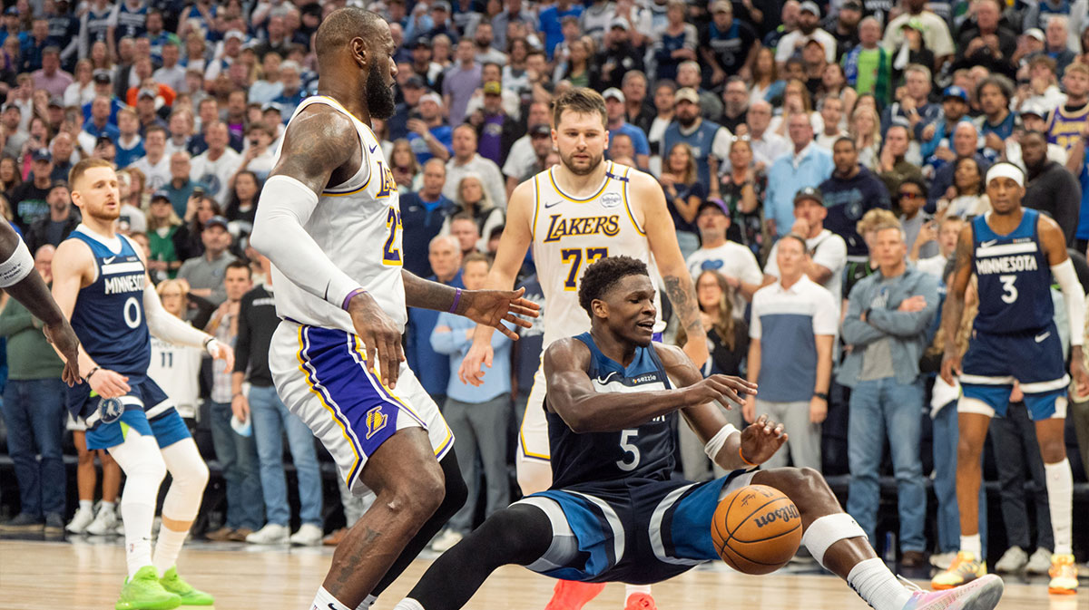 Minnesota Timberwolves guard Anthony Edwards (5) is fouled by Los Angeles Lakers forward LeBron James (23) in the fourth quarter during game four of first round for the 2025 NBA Playoffs at Target Center.