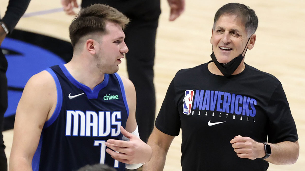 Dallas Mavericks guard Luka Doncic (77) laughs with owner Mark Cuban after the game against the Detroit Pistons at American Airlines Center.
