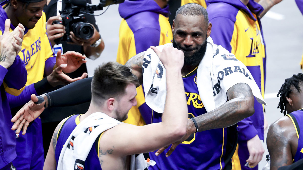 Los Angeles Lakers forward LeBron James (23) celebrates with Los Angeles Lakers guard Luka Doncic (77) during the fourth quarter against the Dallas Mavericks at American Airlines Center.