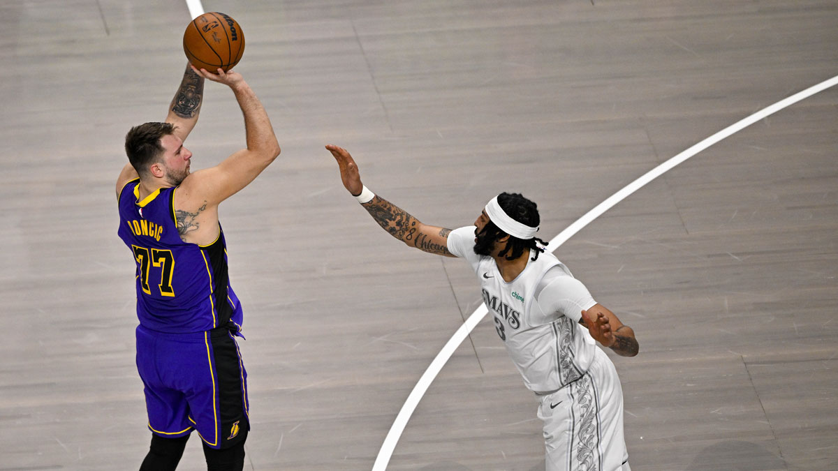 Los Angeles Lakers guard Luka Doncic (77) makes a jump shot over Dallas Mavericks forward Anthony Davis (3) during the first quarter at the American Airlines Center.