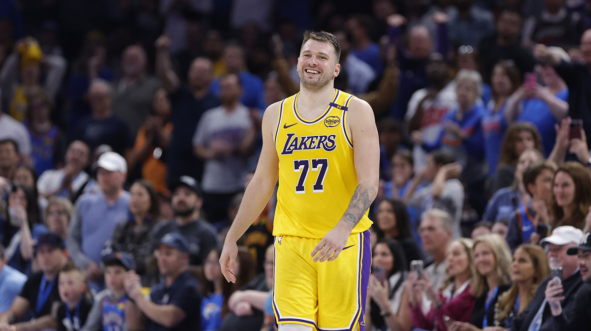 Los Angeles Lakers guard Luka Doncic (77) smiles after a technical is called against him during the second half of a game against the Oklahoma City Thunder at Paycom Center.