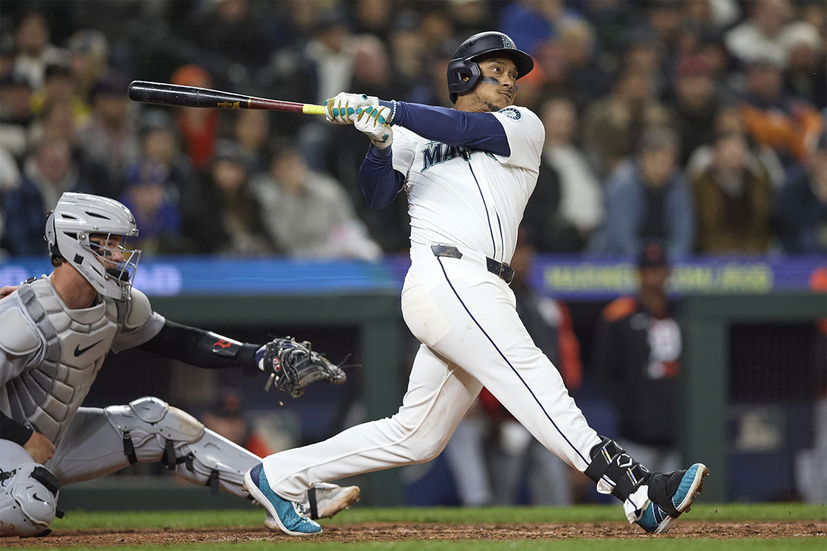 Seattle Mariners first baseman Luke Raley (20) hits an RBI single against the Detroit Tigers during the fifth inning at T-Mobile Park.
