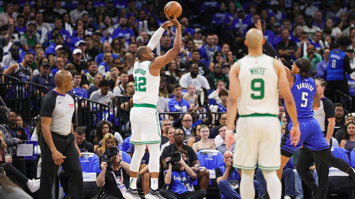 USA; Boston Celtics center Al Horford (42) shoots a three point basket during the first quarter of game three of first round for the 2024 NBA Playoffs against the Orlando Magic at Kia Center.