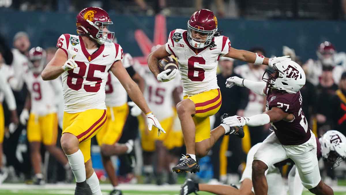 Southern California Trojans wide receiver Makai Lemon (6) carries the ball against Texas A&M Aggies linebacker Daymion Sanford (27) in the second half at Allegiant Stadium.
