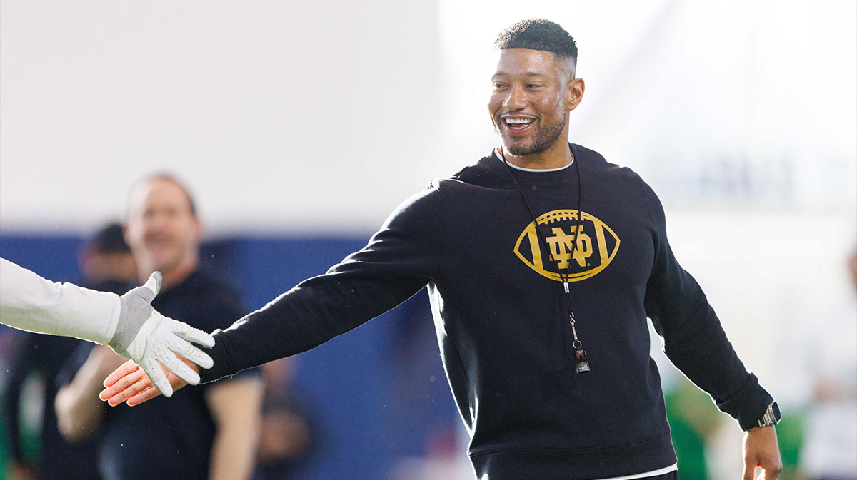 Notre Dame head coach Marcus Freeman greets his players during a Notre Dame football spring practice at Irish Athletic Center