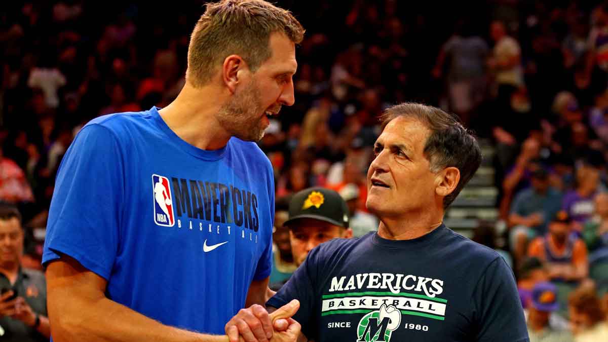 Mark Cuban stands with Dirk Nowitzki after Nico Harrison jab