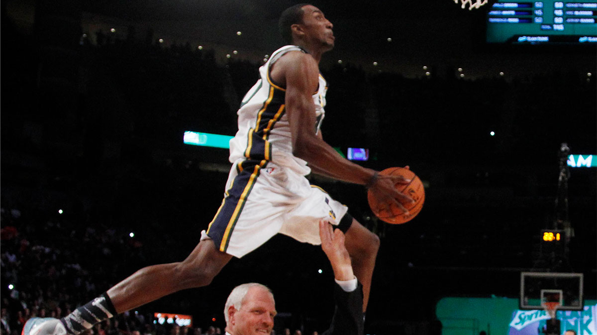 Utah Jazz forward Jeremy Evans (40) jumps over former Jazz center Mark Eaton during the 2013 NBA All-Star slam dunk contest at the Toyota Center.