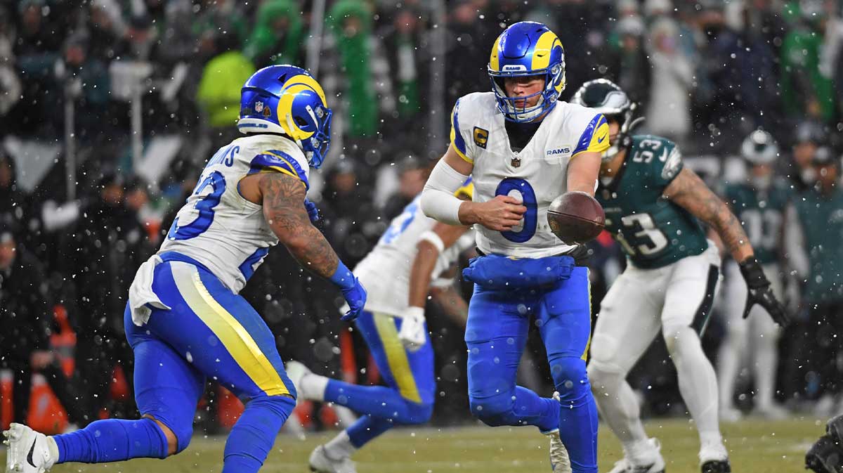 Los Angeles Rams quarterback Matthew Stafford (9) hands the ball off to running back Kyren Williams (23) against the Philadelphia Eagles in a 2025 NFC divisional round game at Lincoln Financial Field. Mandatory Credit: Eric Hartline-Imagn Images