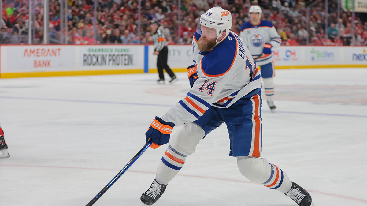 Edmonton Oilers defenseman Mattias Ekholm (14) shoots the puck against the Florida Panthers during the first period at Amerant Bank Arena.