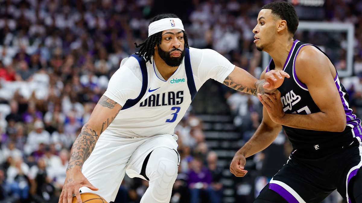 Dallas Mavericks forward Anthony Davis (3) dribbles the ball against Sacramento Kings forward Keegan Murray (13) during the first quarter at Golden 1 Center.