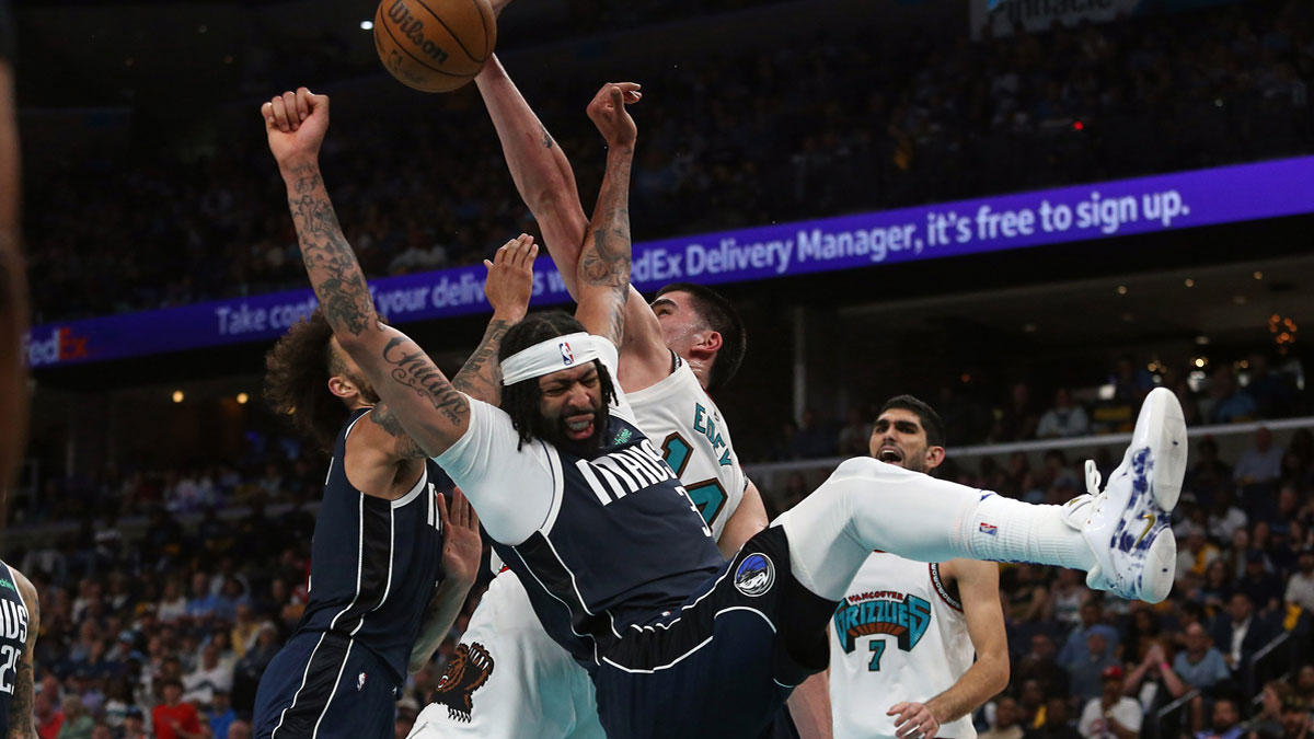 Dallas Mavericks center Dereck Lively II (2), forward Anthony Davis (3) and Memphis Grizzlies center Zach Edey (14) battle for a rebound during the fourth quarter at FedExForum.