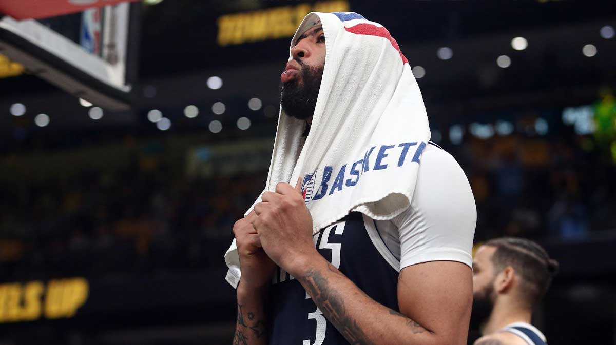 Mavericks forward Anthony Davis (3) reacts