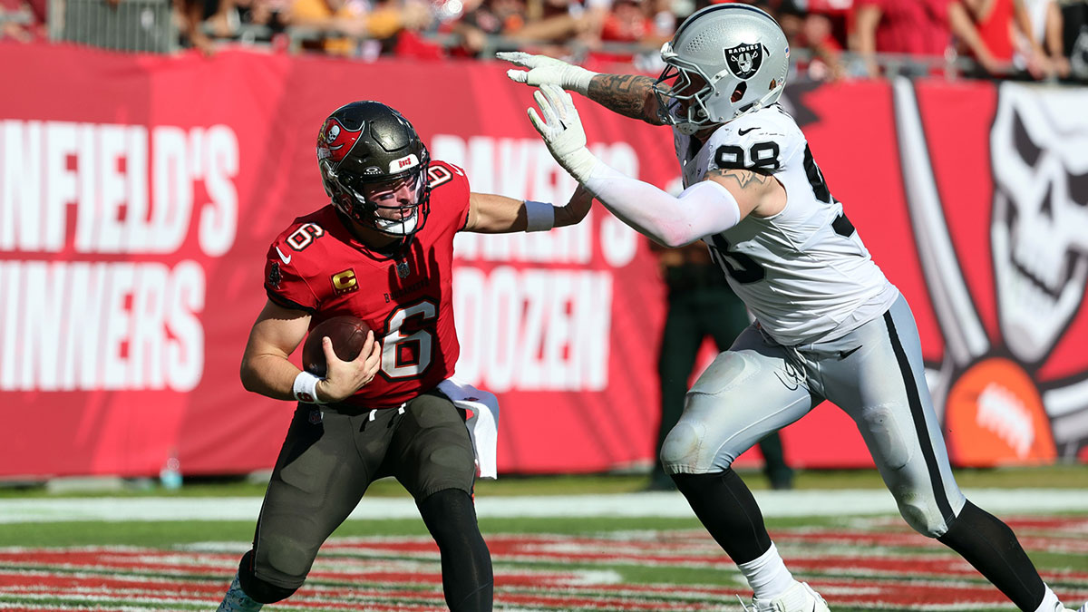 Tampa Bay Buccaneers quarterback Baker Mayfield (6) gets pressured by Las Vegas Raiders defensive end Maxx Crosby (98) during the second quarter at Raymond James Stadium. Mandatory Credit: Kim Klement Neitzel-Imagn Images