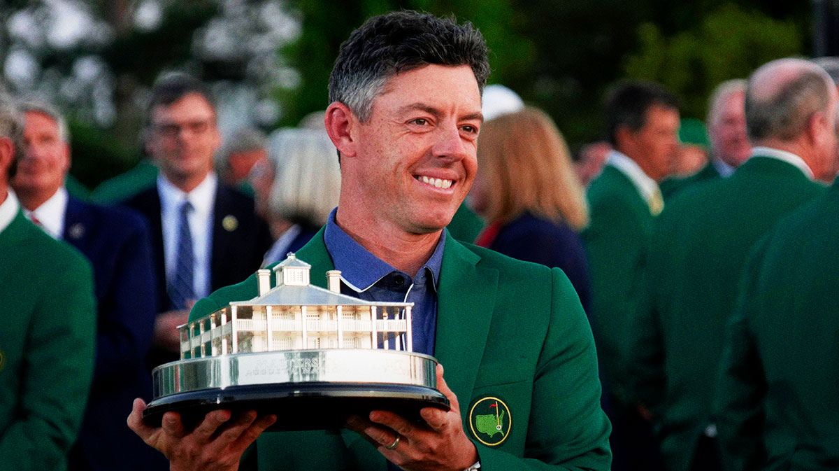 Rory McIlroy celebrates with the trophy after winning the Masters Tournament at Augusta National Golf Club.