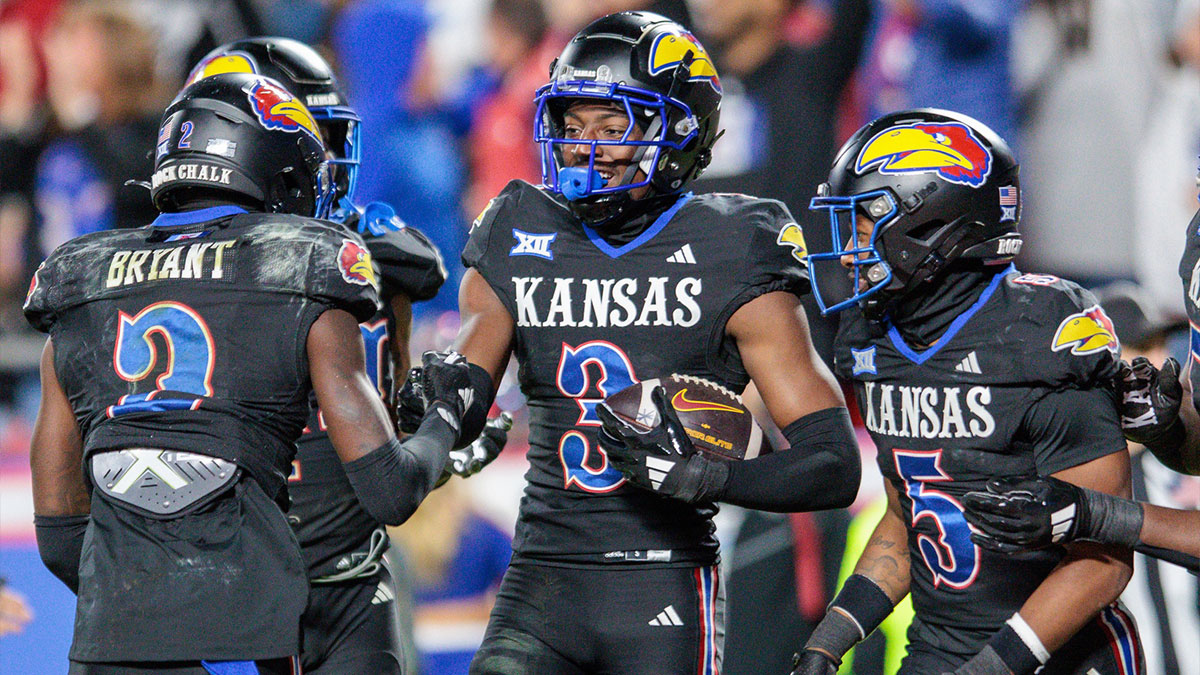 Kansas Jayhawks cornerback Mello Dotson (3) celebrates after scoring a touch down during the fourth quarter against the Iowa State Cyclones at GEHA Field at Arrowhead Stadium. Mandatory Credit: William Purnell-Imagn Images