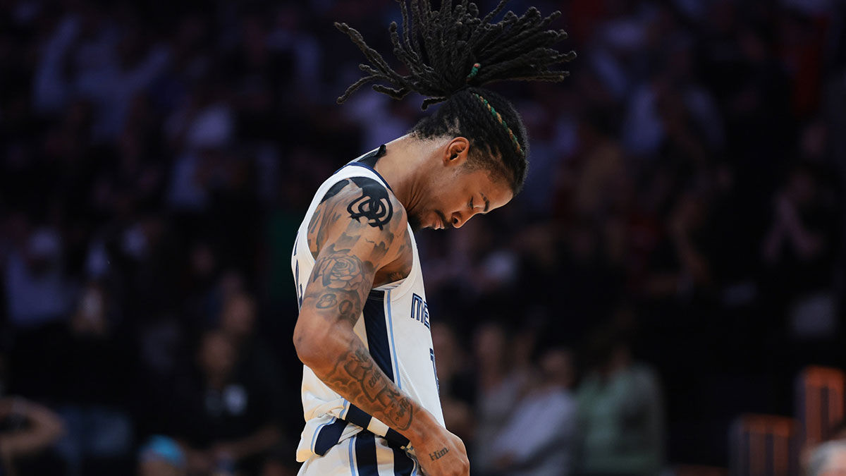 Memphis Grizzlies guard Ja Morant (12) reacts after scoring the game-winning shot against the Miami Heat during the fourth quarter at Kaseya Center.